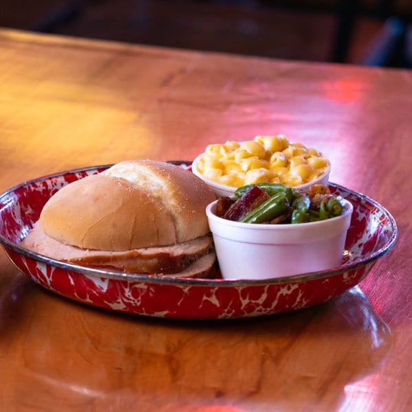 Cindy Lou's BBQ pulled pork sandwich with sides of mac and cheese and green beans.